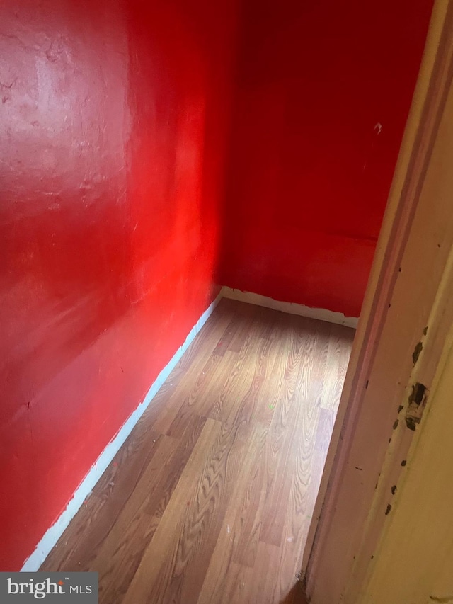 empty room with wood-type flooring