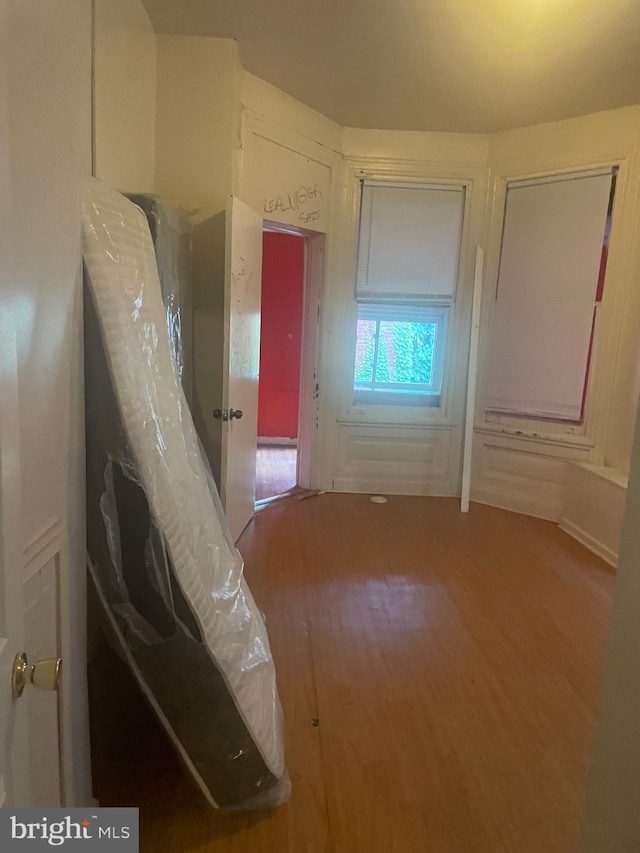 bedroom with wood-type flooring