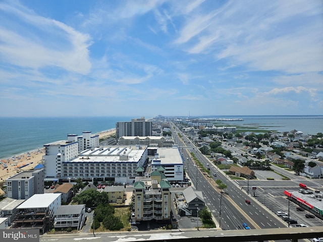 aerial view with a water view and a beach view