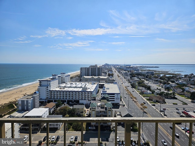 drone / aerial view with a water view and a view of the beach