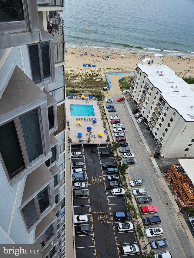 aerial view featuring a view of the beach and a water view