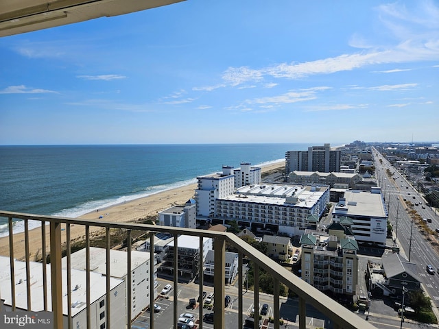 exterior space featuring a beach view and a water view