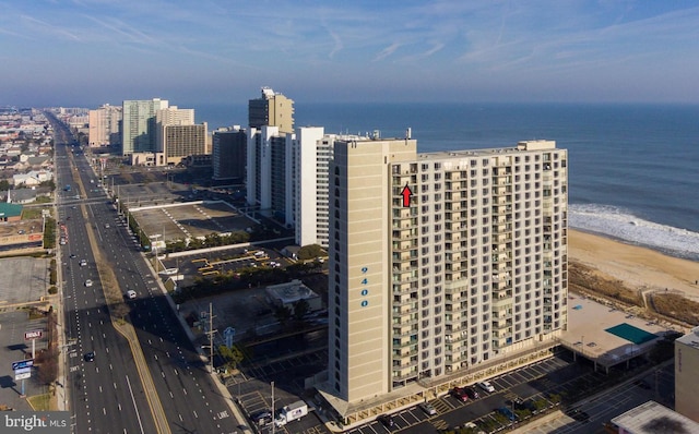 bird's eye view with a beach view and a water view