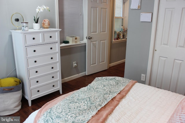 bedroom featuring dark wood-type flooring