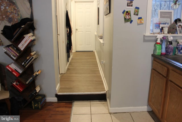 hallway with light tile patterned floors