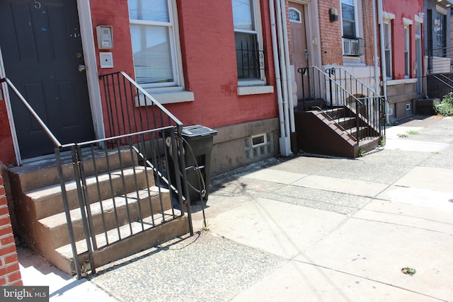 doorway to property featuring central AC