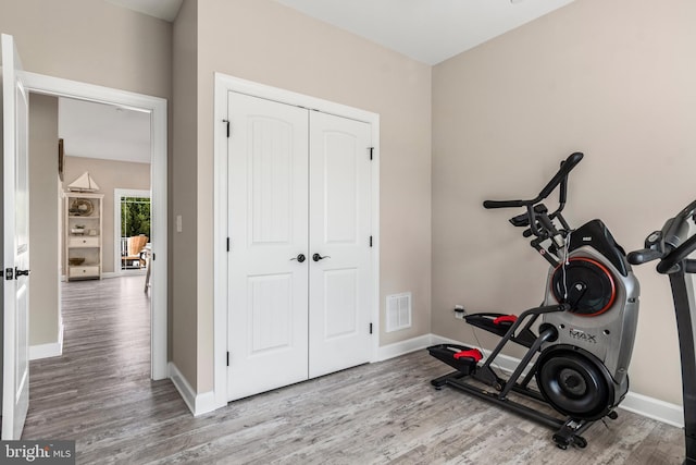 exercise area with hardwood / wood-style flooring