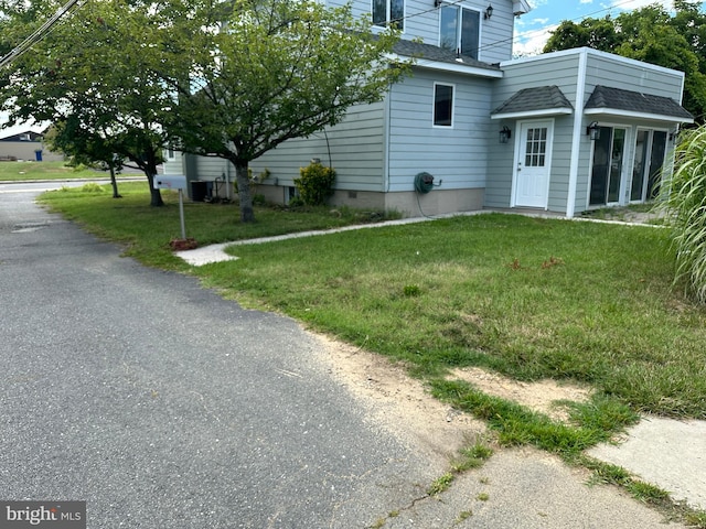 view of property exterior featuring a yard