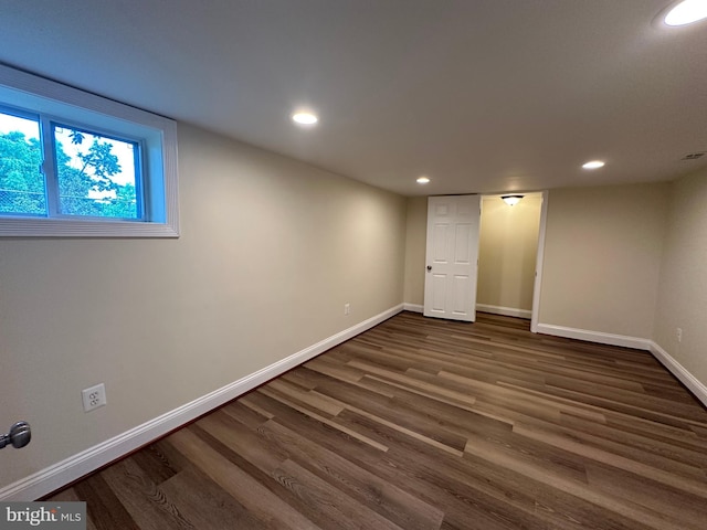 basement featuring dark hardwood / wood-style flooring