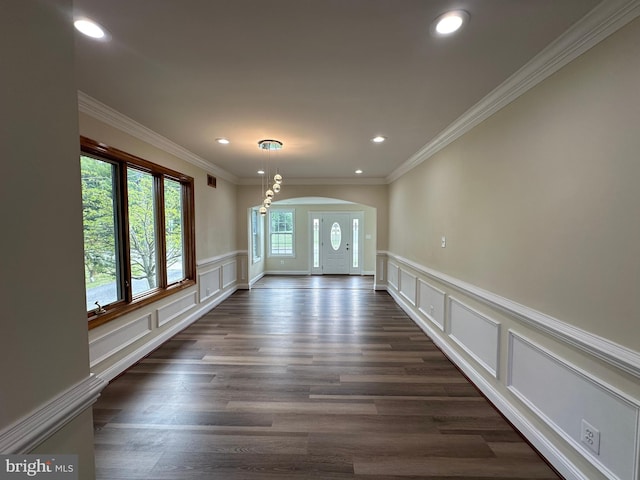 interior space featuring crown molding and dark hardwood / wood-style floors