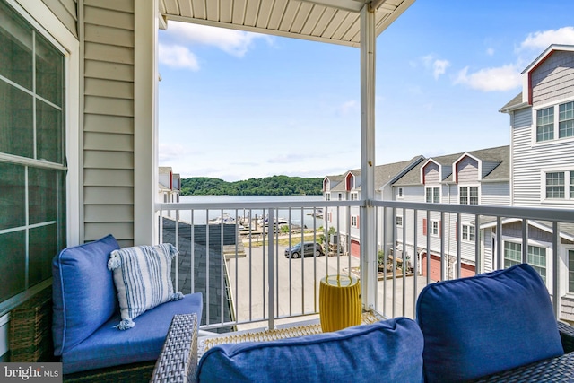 balcony featuring a water view