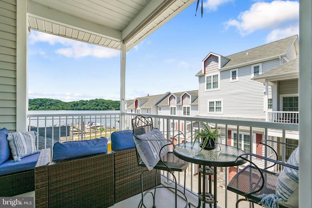 balcony featuring a water view