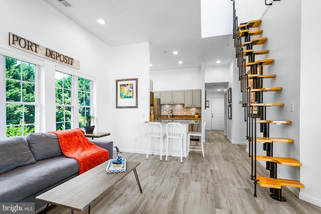 living room with light hardwood / wood-style floors