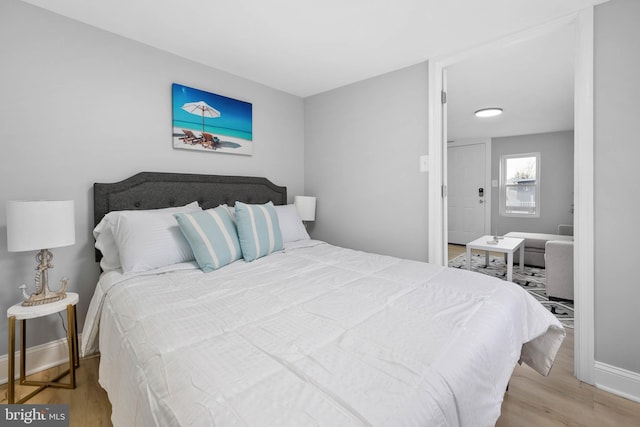 bedroom with light hardwood / wood-style floors