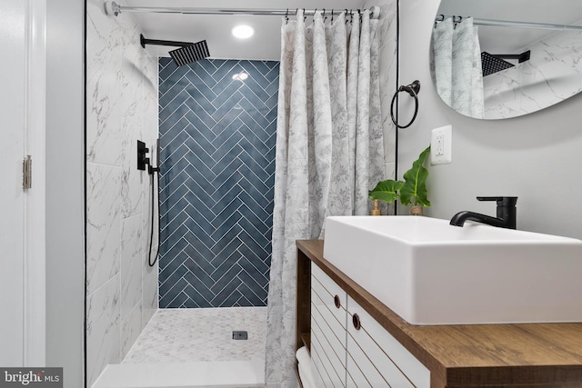 bathroom with vanity and a shower with shower curtain