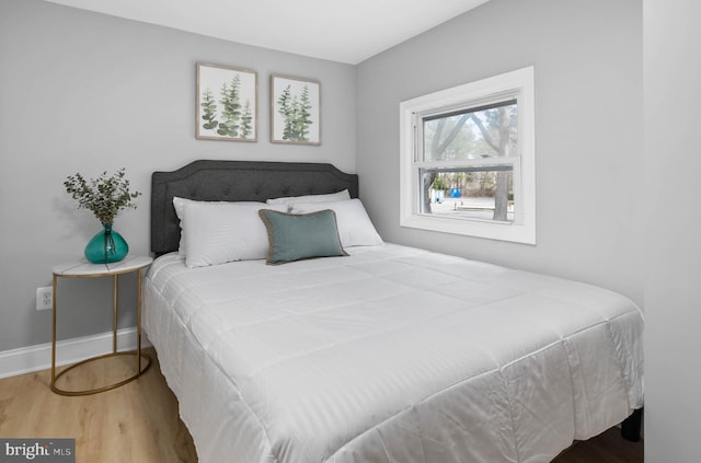 bedroom with hardwood / wood-style floors