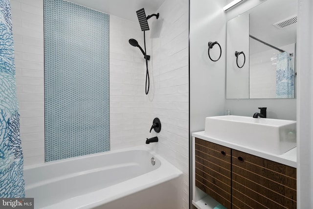 bathroom with vanity and washtub / shower combination