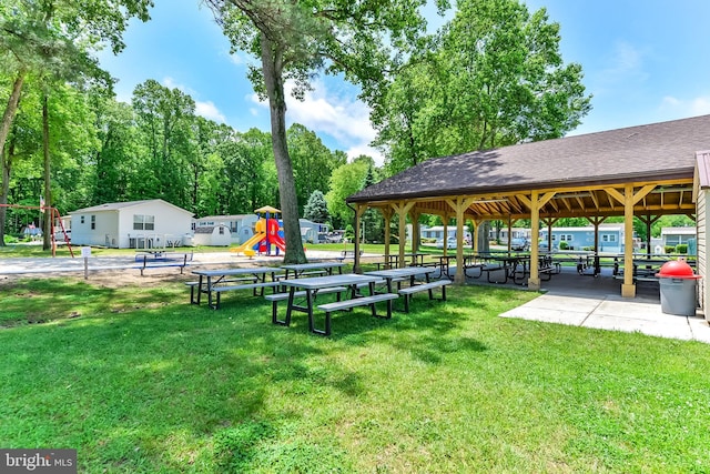 surrounding community featuring a playground and a yard