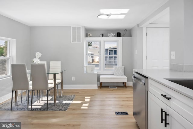 dining space with light wood-type flooring