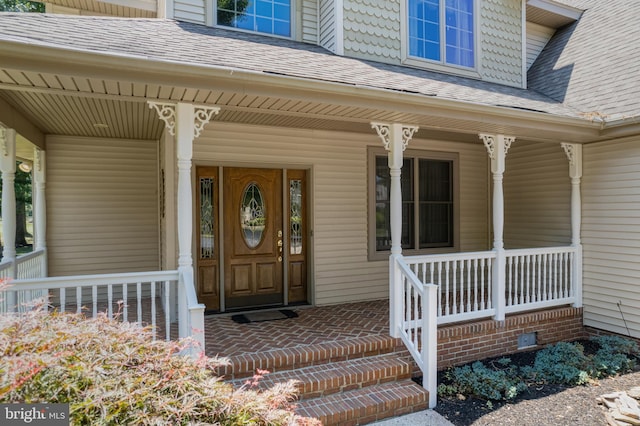 entrance to property with covered porch