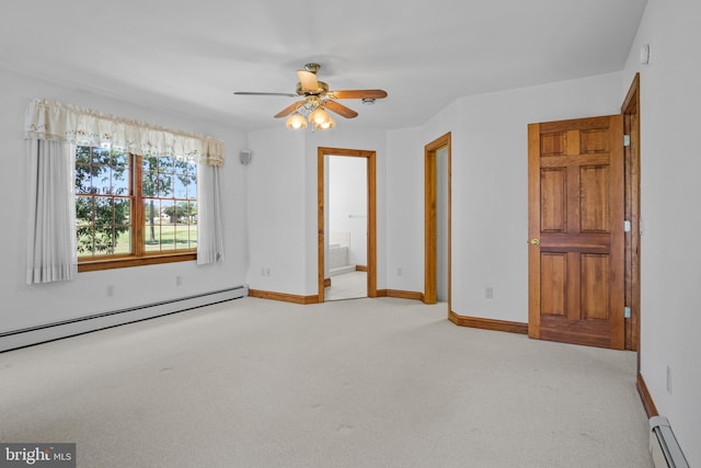 unfurnished bedroom with ensuite bathroom, ceiling fan, light colored carpet, and baseboard heating