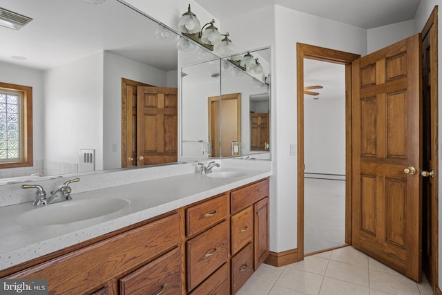 bathroom with tile patterned flooring and vanity