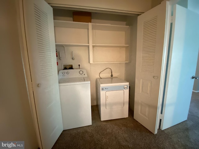 laundry room with dark colored carpet and separate washer and dryer