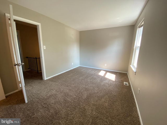 view of carpeted spare room