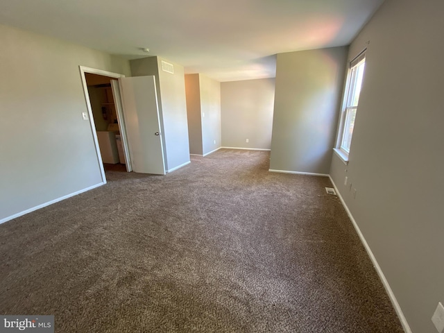 empty room featuring carpet flooring