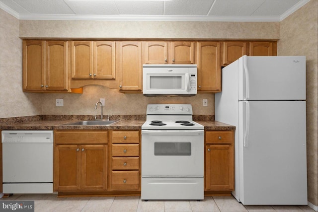 kitchen with light tile patterned floors, crown molding, white appliances, and sink