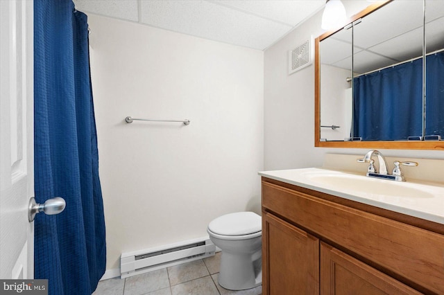 bathroom with vanity, tile patterned floors, a paneled ceiling, a baseboard radiator, and toilet