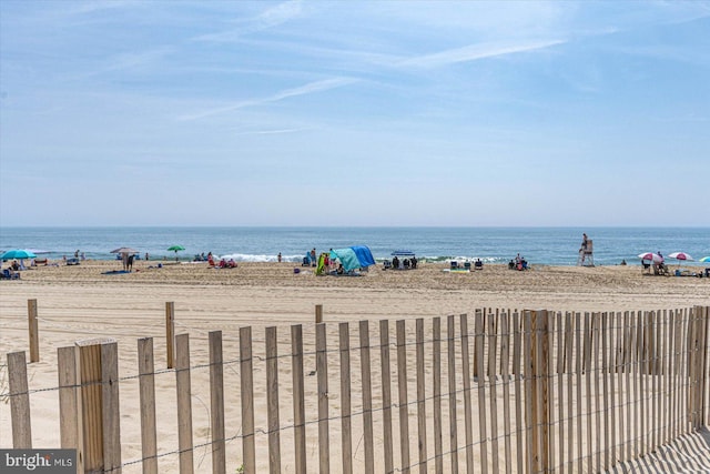 property view of water featuring a beach view