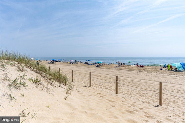 view of water feature with a beach view