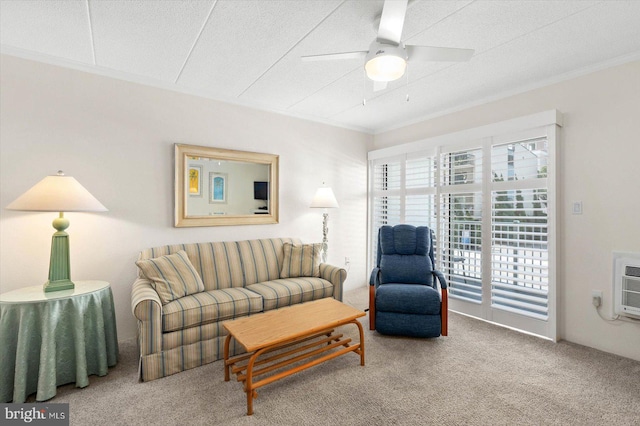 carpeted living room with a textured ceiling, crown molding, and ceiling fan