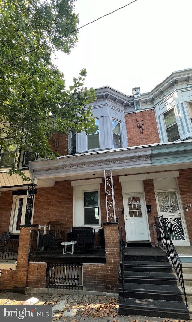 view of property featuring a porch