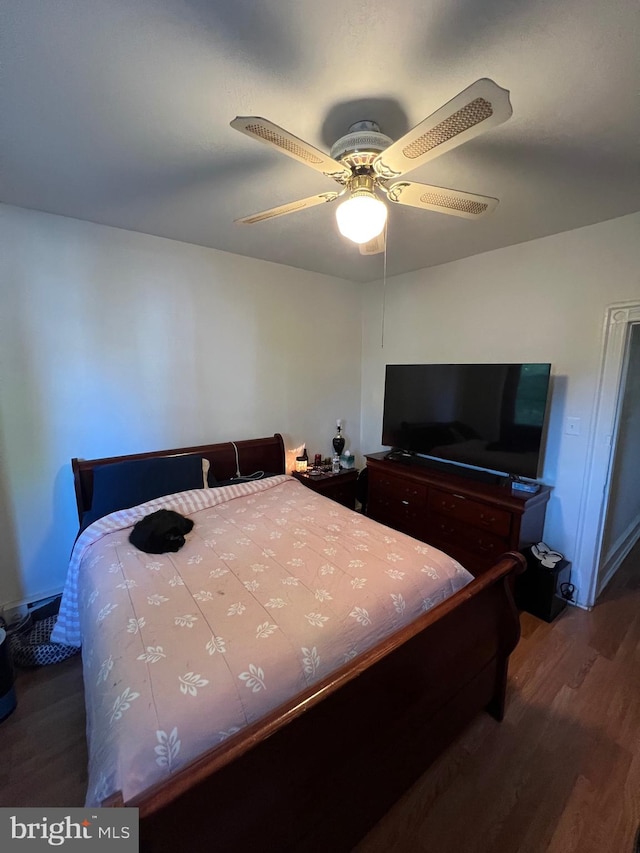 bedroom featuring ceiling fan and hardwood / wood-style flooring