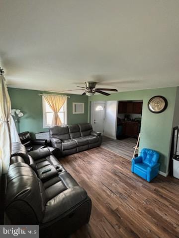 living room with hardwood / wood-style flooring and ceiling fan