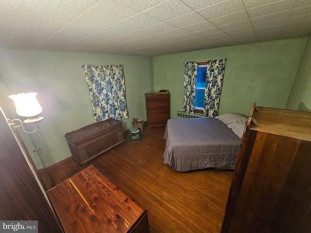 bedroom with hardwood / wood-style floors