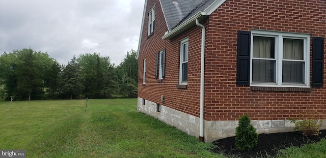 view of property exterior featuring a yard