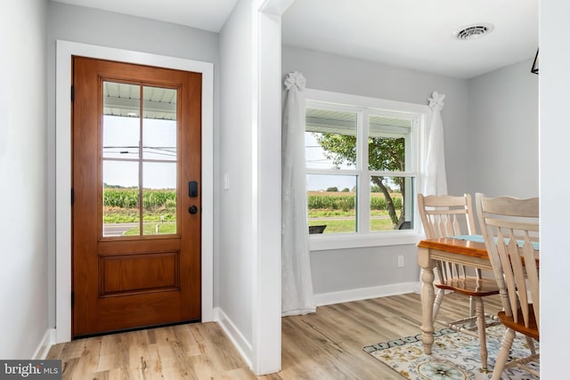 doorway to outside with light hardwood / wood-style flooring