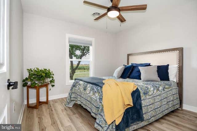 bedroom featuring ceiling fan and light hardwood / wood-style floors