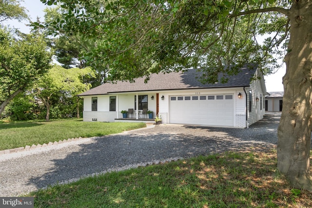 ranch-style home with a porch, a garage, and a front yard