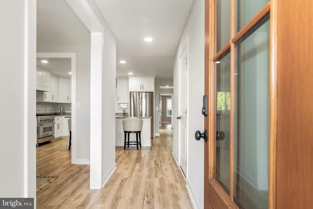 hallway featuring light wood-type flooring