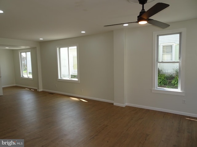 unfurnished room featuring ceiling fan, baseboards, dark wood finished floors, and recessed lighting