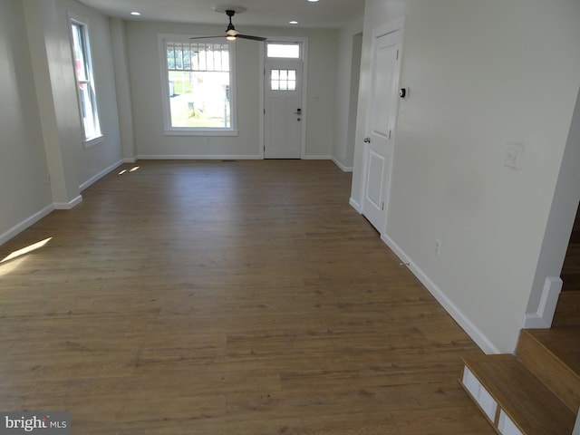 entrance foyer with dark wood finished floors, recessed lighting, ceiling fan, baseboards, and stairs