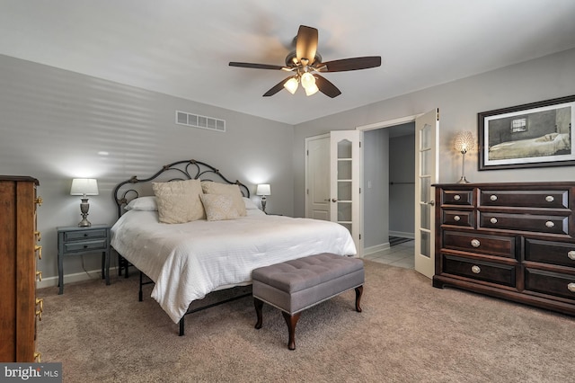 bedroom with carpet, french doors, and ceiling fan