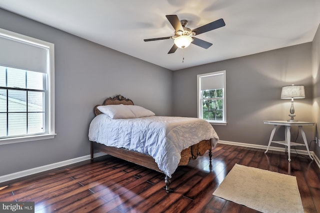 bedroom featuring ceiling fan and dark hardwood / wood-style flooring