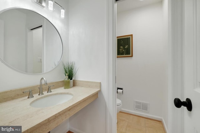 bathroom with toilet and sink