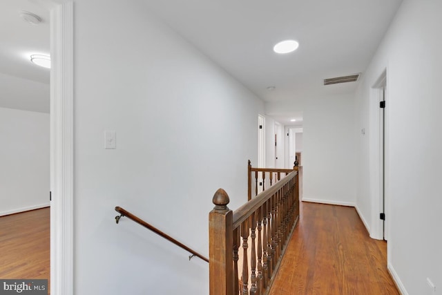 hallway with wood-type flooring