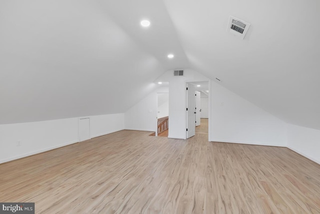 bonus room featuring light hardwood / wood-style flooring and lofted ceiling